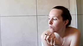 cute babe smoking in the bathroom with neighbors around