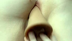 young woman enjoys toy sucking and intimate play