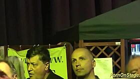 Intense cock sharing on public stage