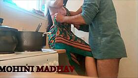 Unsatisfied milf licks neighbor's big tits before doggystyle in the kitchen.