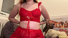 A blonde amateur shows off her red outfit and feet