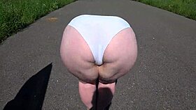 Girlfriend fucks milf with strap-on outdoors!