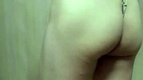 Gorgeous asian model in gold leotard undergoes long buttplug training session