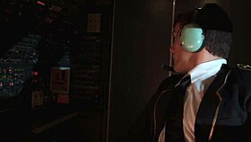 Madelyn Marie fucks captain in cockpit during red eye flight.