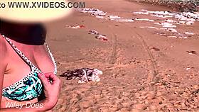wifey shows off her big tits while flashing at the beach in a bikini