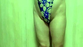 Gorgeous asian model in gold leotard undergoes long buttplug training session