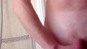 Bashing those big balls and stroking a nice cock too.