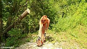 Is she sawing wood in a bikini outdoors in the forest with her small shaved tits?