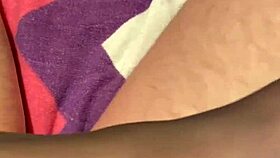 giving the hubby a foot massage in black reinforced toe stockings