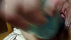 blonde tattooed girl subtly masturbating with dildo