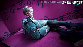 tattoo girl solo with toys and plugs for stretching