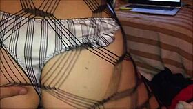 Sexy woman in dress, panties, heels, and stockings gives blowjob then doggystyle fucking