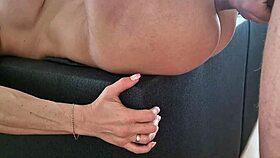 a naked milf lies on the floor in a scene