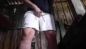 village brunette sneaks to the barn for solo play, keeping clothes on to avoid getting caught.