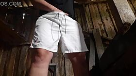 village brunette sneaks to the barn for solo play, keeping clothes on to avoid getting caught.