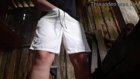 village brunette sneaks to the barn for solo play, keeping clothes on to avoid getting caught.