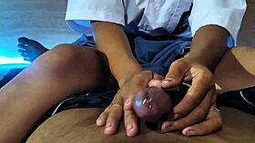 Asian schoolgirl teases and jerks cock in amateur video