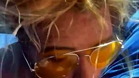 Blonde woman receives facial in public setting