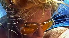 Blonde woman receives facial in public setting