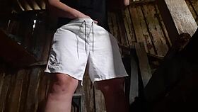 village brunette sneaks to the barn for solo play, keeping clothes on to avoid getting caught.