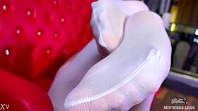 Goddess With Big Booty Teases Feet In White Stockings On Red Couch