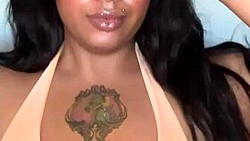 This ebony milf in a bikini dances, shaking her big tits and ass