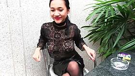 is that young girl smoking topless in leather?