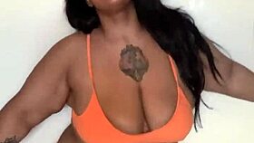 This ebony milf in a bikini dances, shaking her big tits and ass