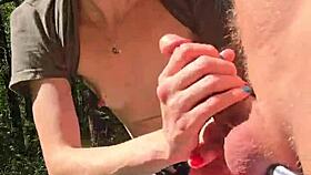 Wife gives quick handjob with pierced nipples while out on a public walk