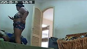 hidden camera catches the brazilian milf maid cleaning naked, showing off her huge tits and big pussy in lingerie