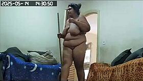 hidden camera catches the brazilian milf maid cleaning naked, showing off her huge tits and big pussy in lingerie
