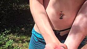 Wife gives quick handjob with pierced nipples while out on a public walk