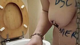 Oh, what a humiliated slut! She licks the toilet in bondage humiliation.