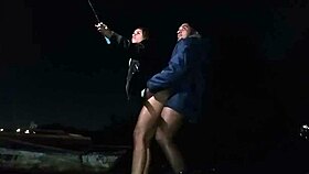 Wife gives to friend on beach