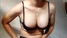 This amateur shemale in black bra and stockings is cumming on a handkerchief.