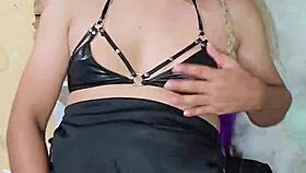 The transsexual dances seductively in crossdressing attire