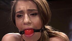 Gagged slave rides vibrator in tight bondage