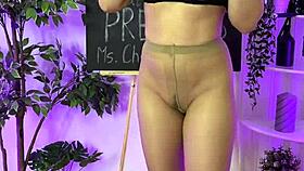 Oh wow, sexy milf in heels and glasses putting on leather harness! Domination time!