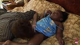 black midget with big tits and nipples performs in video