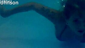 Melissa the mermaid with tattoo in pool