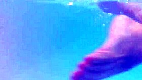 Melissa the mermaid with tattoo in pool