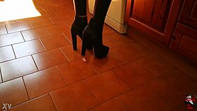 in the er, a tall mistress in heels dominates her slave with bdsm