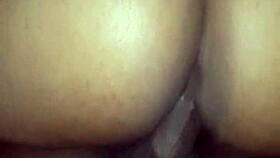 mature ebony couple bent over in a wild frenzy with big cock.