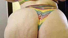 Rainbow clad joan day plays with herself and shakes big ass