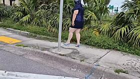 Muslim woman in hijab at bus stop interacting with stranger