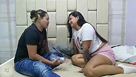 Two girls play bottle game and start licking pussies