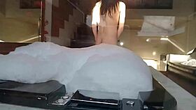 Spying on brunette bathing, guy in feminine clothing fucks her pear-shaped ass and buries cock in anus