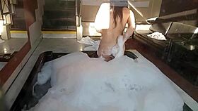 Spying on brunette bathing, guy in feminine clothing fucks her pear-shaped ass and buries cock in anus