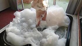 Spying on brunette bathing, guy in feminine clothing fucks her pear-shaped ass and buries cock in anus