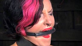 Alt submissive receives clit paddling treatment with whipping and bondage